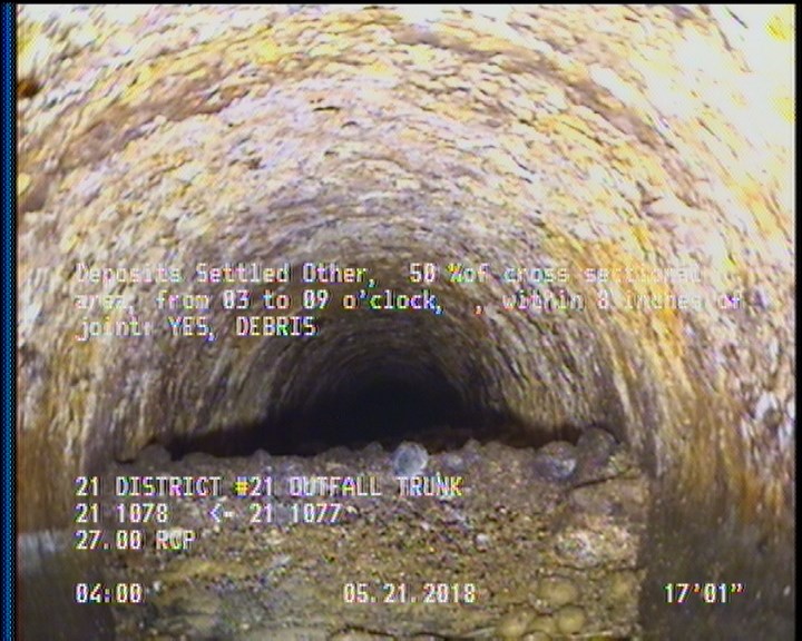 Deposits Settled Other, 50 %of cross sectional area, from 03 to 09 o'clock, , within 8 inches of joint: YES - DEBRIS