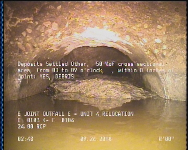 Deposits Settled Other, 50 %of cross sectional area, from 03 to 09 o'clock, , within 8 inches of joint: YES - DEBRIS