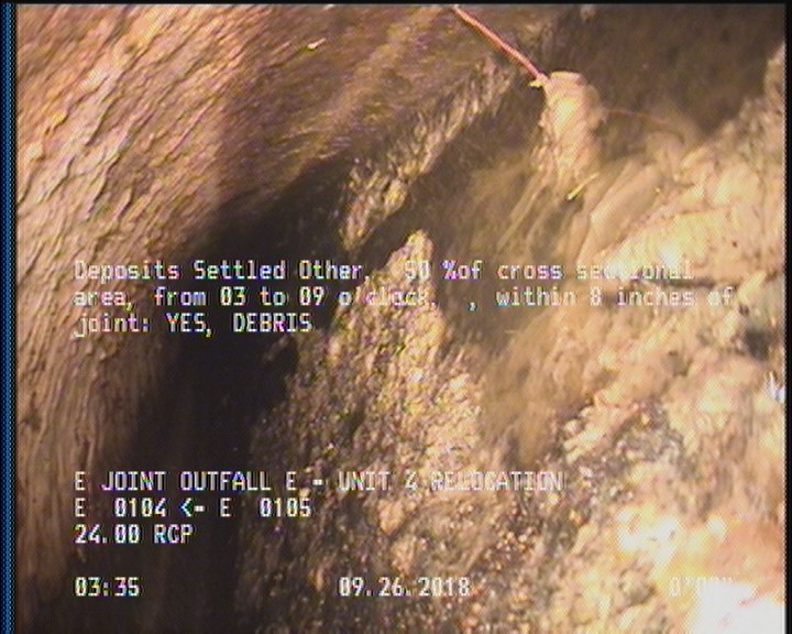 Deposits Settled Other, 50 %of cross sectional area, from 03 to 09 o'clock, , within 8 inches of joint: YES - DEBRIS