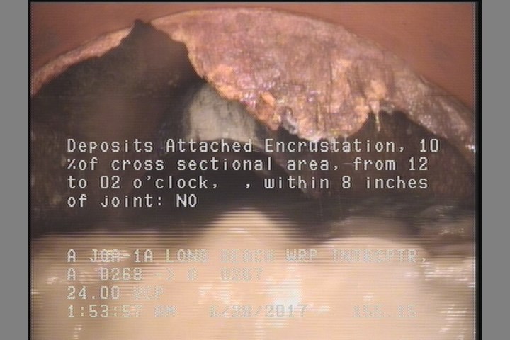 Deposits Attached Encrustation, 10 %of cross sectional area, from 12 to 02 o'clock, , within 8 inches of joint: NO