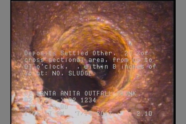 Deposits Settled Other, 20 %of cross sectional area, from 05 to 07 o'clock, , within 8 inches of joint: NO - SLUDGE