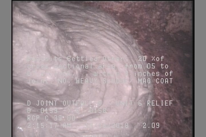 Deposits Settled Other, 20 %of cross sectional area, from 05 to 07 o'clock, , within 8 inches of joint: NO - HEAVY SLUDGE/ MAG COAT