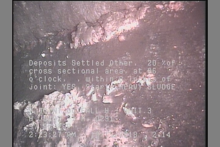 Deposits Settled Other, 20 %of cross sectional area, at 06 o'clock, , within 8 inches of joint: YES, Start - HEAVY SLUDGE