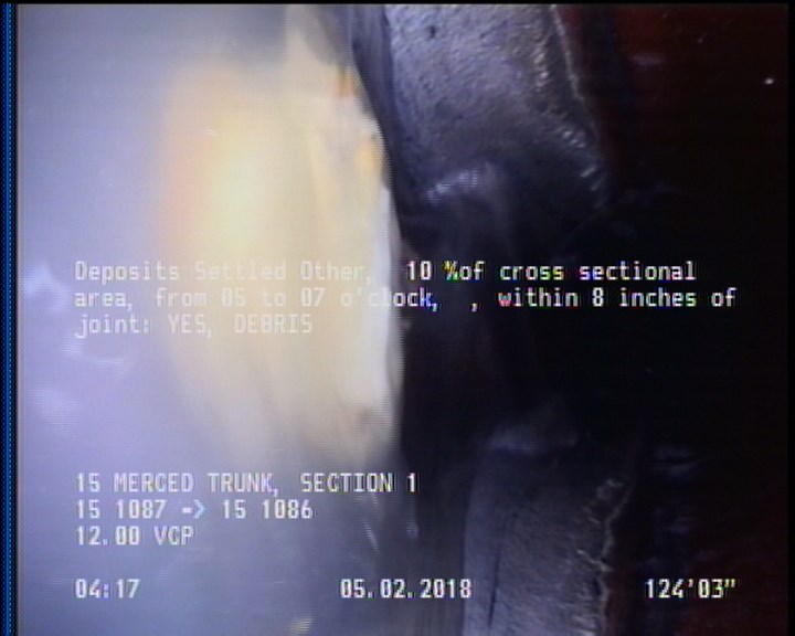 Deposits Settled Other, 10 %of cross sectional area, from 05 to 07 o'clock, , within 8 inches of joint: YES - DEBRIS