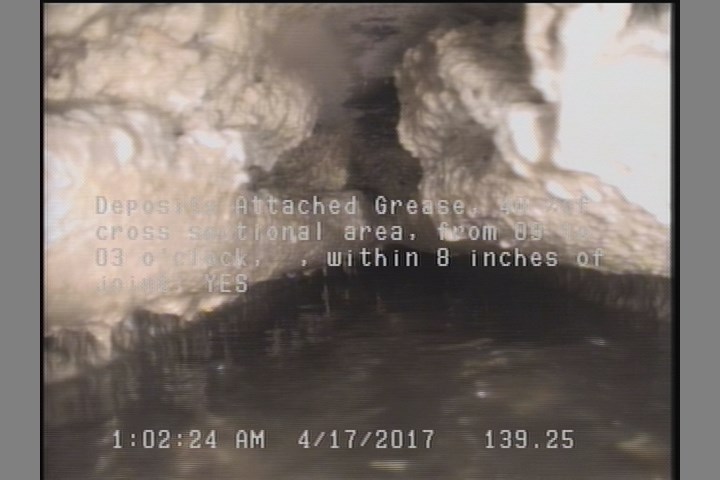 Deposits Attached Grease, 40 %of cross sectional area, from 09 to 03 o'clock, , within 8 inches of joint: YES