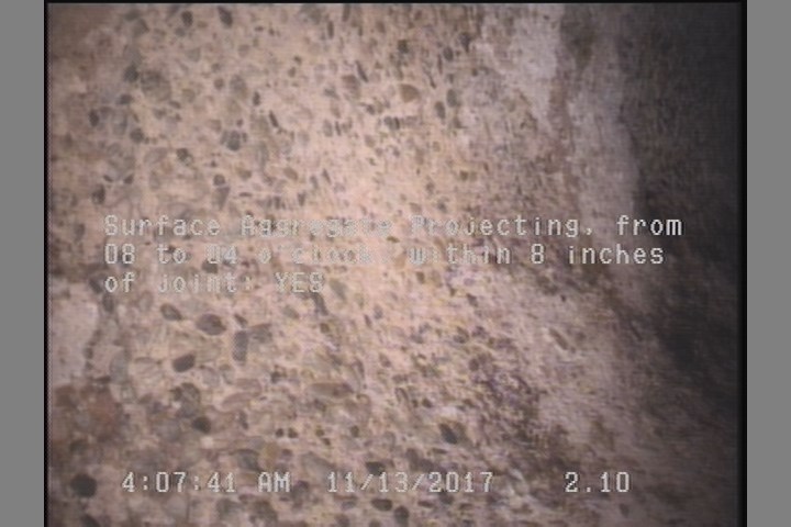 Surface Aggregate Projecting, from 08 to 04 o'clock, within 8 inches of joint: YES