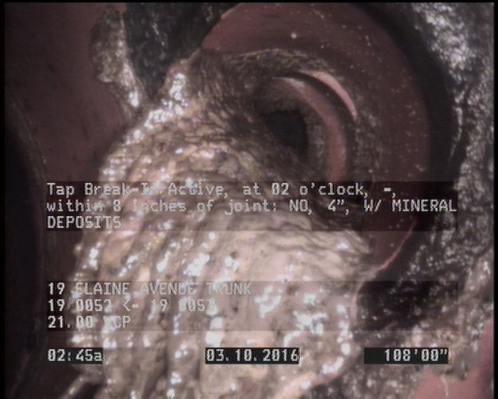 Tap Break-In Active, at 02 o'clock, -, within 8 inches of joint: NO, 4" - W/ MINERAL DEPOSITS