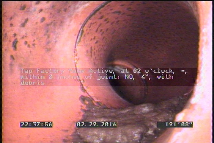 Tap Factory Made Active, at 02 o'clock, -, within 8 inches of joint: NO, 4" - with debris