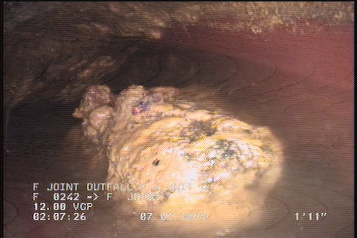 Deposits Settled Other, 15 %of cross sectional area, from 04 to 08 o'clock, , within 8 inches of joint: YES - UNKOWN DEBRIS