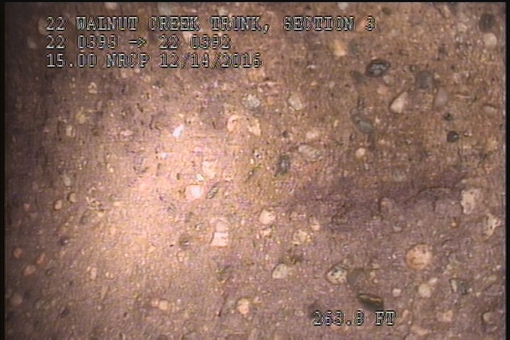 Surface Aggregate Projecting, from 09 to 03 o'clock, within 8 inches of joint: NO - SEVERE AGG