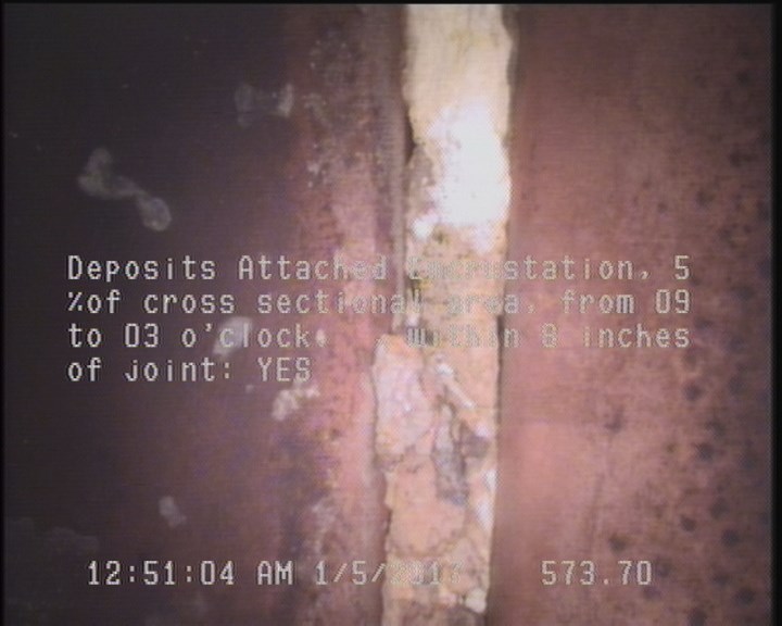 Deposits Attached Encrustation, 5 %of cross sectional area, from 09 to 03 o'clock, , within 8 inches of joint: YES