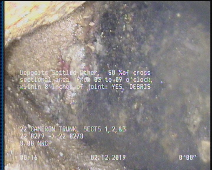 Deposits Settled Other, 50 %of cross sectional area, from 03 to 09 o'clock, , within 8 inches of joint: YES - DEBRIS