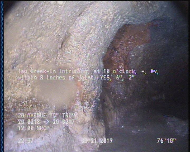 Tap Break-In Intruding, at 10 o'clock, -, #v, within 8 inches of joint: YES, 6", 2"
