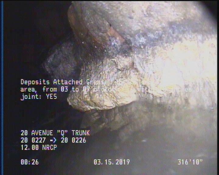 Deposits Attached Grease, 15 %of cross sectional area, from 03 to 09 o'clock, , within 8 inches of joint: YES