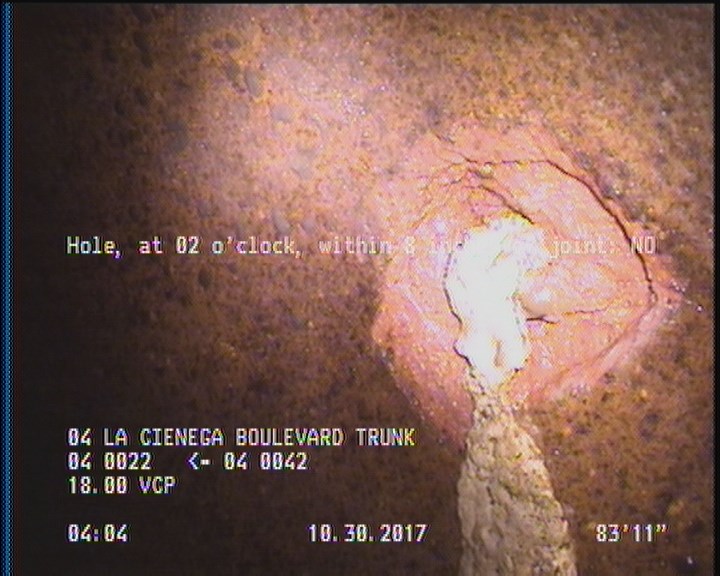 Hole, at 02 o'clock, within 8 inches of joint: NO - HAS A POSSIBLE REPAIR BEHIND THE HOLE