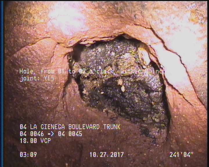 Hole, from 01 to 02 o'clock, within 8 inches of joint: YES - POSSIBLE REPAIR BEHIND HOLE