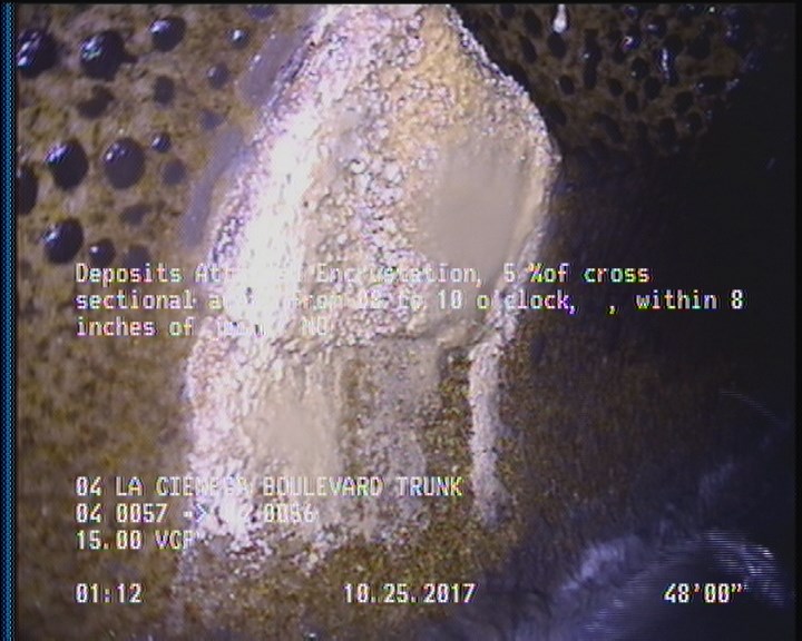 Deposits Attached Encrustation, 5 %of cross sectional area, from 08 to 10 o'clock, , within 8 inches of joint: NO