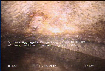 Surface Aggregate Projecting, from 10 to 02 o'clock, within 8 inches of joint: YES