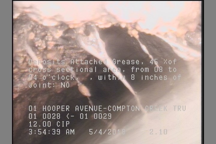 Deposits Attached Grease, 45 %of cross sectional area, from 08 to 04 o'clock, , within 8 inches of joint: NO