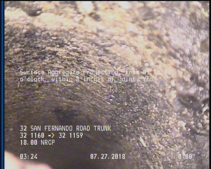 Surface Aggregate Projecting, from 09 to 03 o'clock, within 8 inches of joint: YES