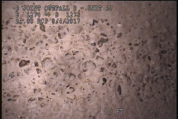 Surface Aggregate Projecting, from 03 to 04 o'clock, within 8 inches of joint: YES, - SEVERE AGG UNDER MAG COAT