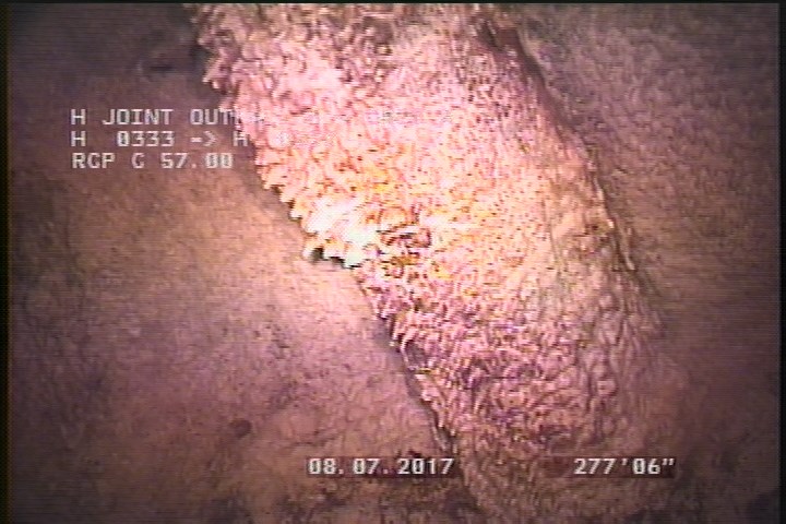 General Observation - PIPE RUNS THROUGH MH
