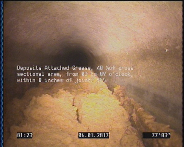Deposits Attached Grease, 40 %of cross sectional area, from 03 to 09 o'clock, , within 8 inches of joint: YES