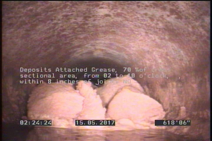 Deposits Attached Grease, 70 %of cross sectional area, from 02 to 10 o'clock, , within 8 inches of joint: NO