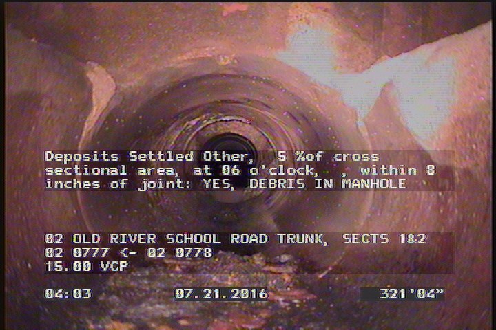 Deposits Settled Other, 5 %of cross sectional area, at 06 o'clock, , within 8 inches of joint: YES - DEBRIS IN MANHOLE