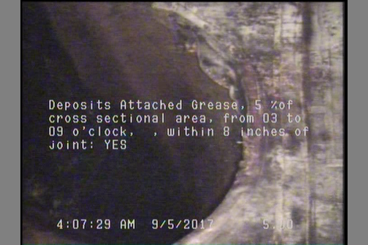 Deposits Attached Grease, 5 %of cross sectional area, from 03 to 09 o'clock, , within 8 inches of joint: YES