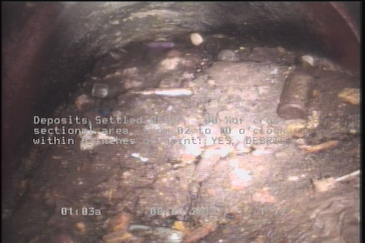Deposits Settled Other, 80 %of cross sectional area, from 02 to 10 o'clock, , within 8 inches of joint: YES - DEBRIS