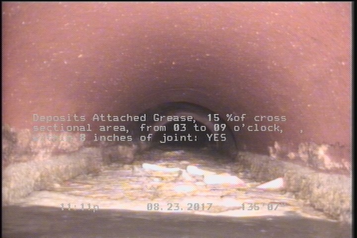 Deposits Attached Grease, 15 %of cross sectional area, from 03 to 09 o'clock, , within 8 inches of joint: YES