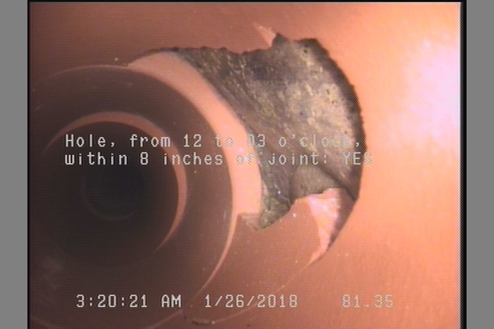 Hole, from 12 to 03 o'clock, within 8 inches of joint: YES - LOOKS LIKE IT MIGHT HAVE A REPAIR