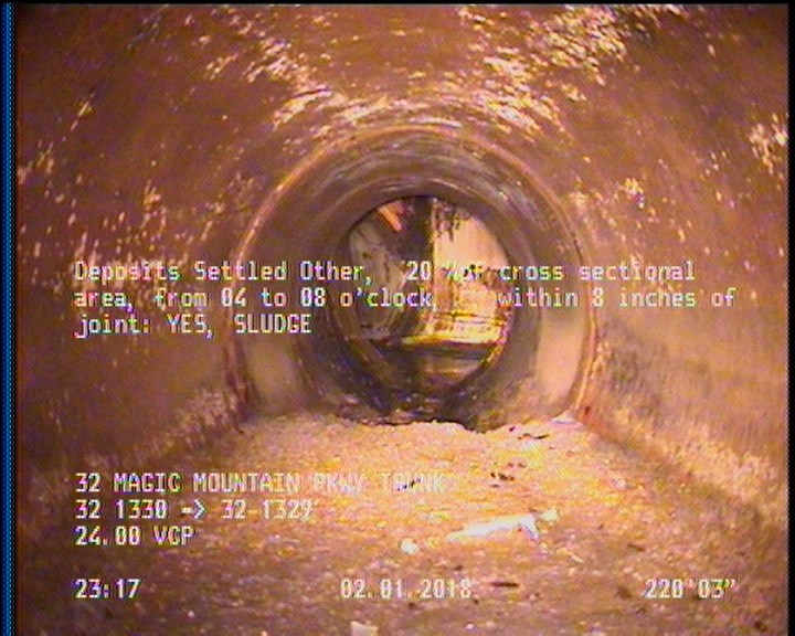 Deposits Settled Other, 20 %of cross sectional area, from 04 to 08 o'clock, , within 8 inches of joint: YES - SLUDGE