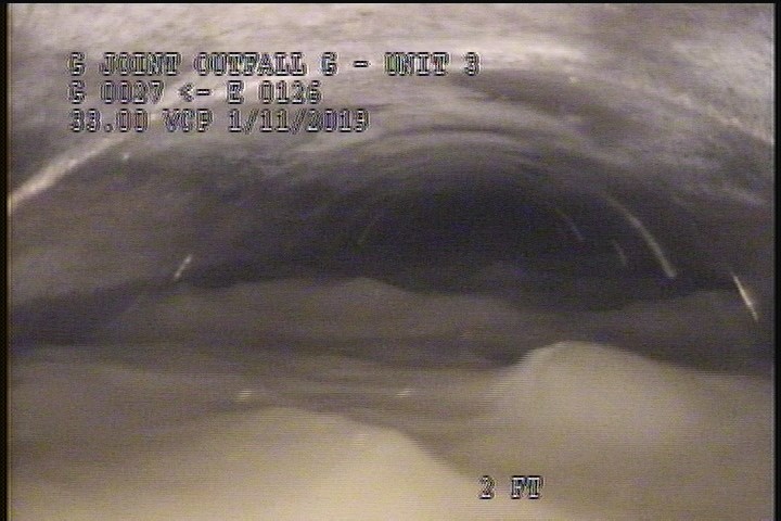 Downstream Manhole, Survey Begins - 8:25 AM