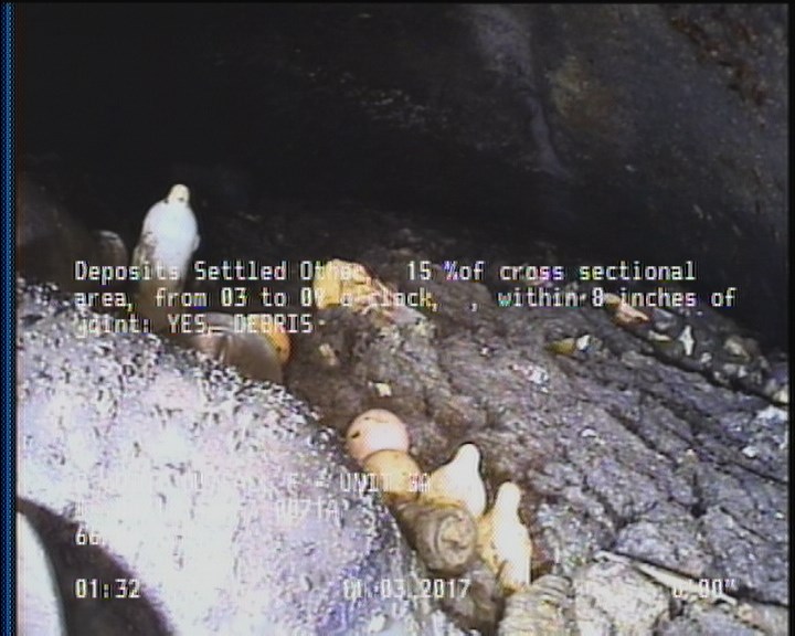 Deposits Settled Other, 15 %of cross sectional area, from 03 to 09 o'clock, , within 8 inches of joint: YES - DEBRIS