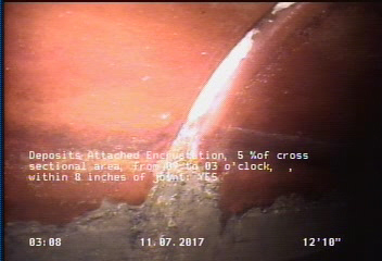 Deposits Attached Encrustation, 5 %of cross sectional area, from 09 to 03 o'clock, , within 8 inches of joint: YES