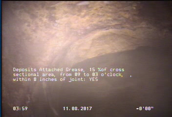 Deposits Attached Grease, 15 %of cross sectional area, from 09 to 03 o'clock, , within 8 inches of joint: YES