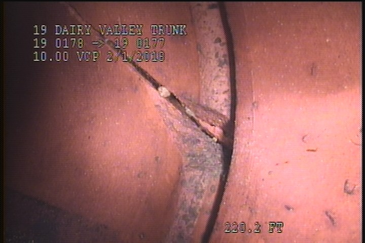 Broken, from 08 to 04 o'clock, within 8 inches of joint: YES