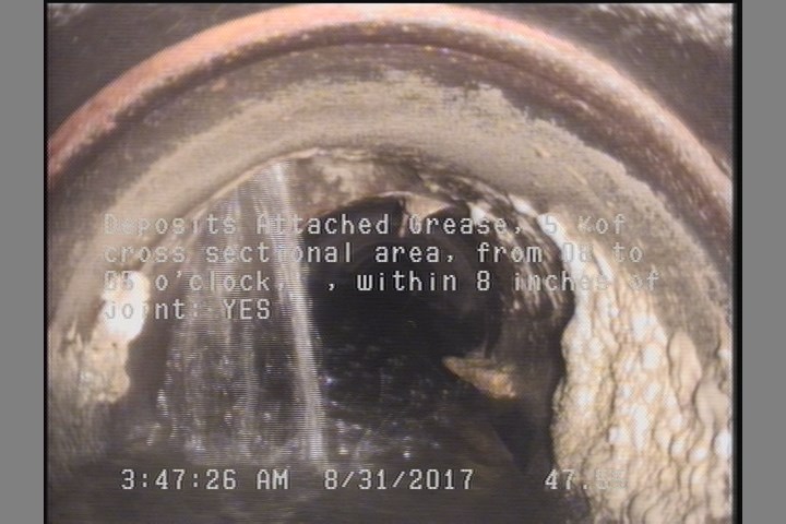 Deposits Attached Grease, 5 %of cross sectional area, from 08 to 05 o'clock, , within 8 inches of joint: YES