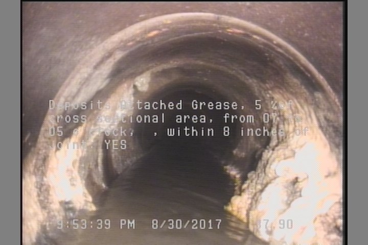 Deposits Attached Grease, 5 %of cross sectional area, from 07 to 05 o'clock, , within 8 inches of joint: YES
