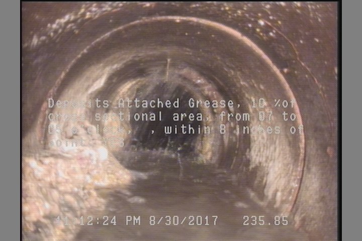 Deposits Attached Grease, 10 %of cross sectional area, from 07 to 05 o'clock, , within 8 inches of joint: YES