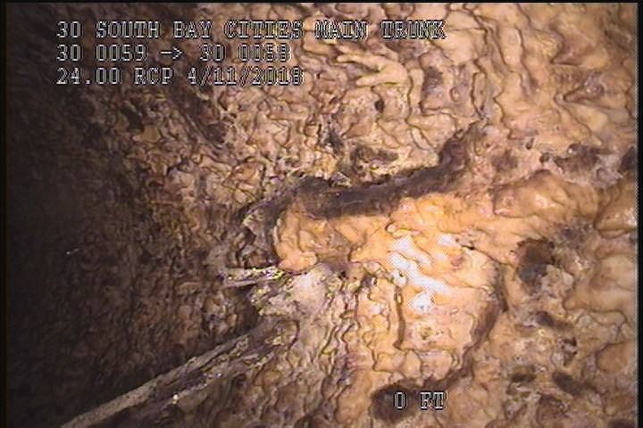 Surface Reinforcement Corroded, from 10 to 02 o'clock, within 8 inches of joint: YES, - LONG & CIRCUM REBAR POSSIBLE UNDER MAG COAT