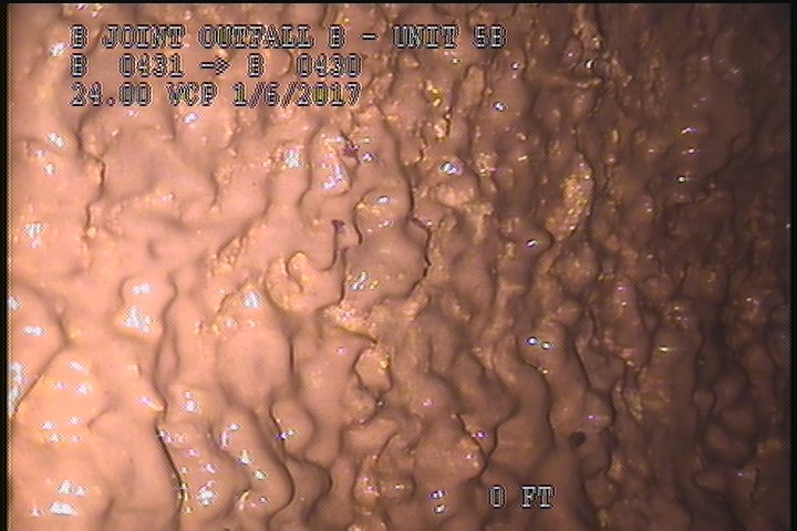 General Observation - POSSIBLE LINE IS CONCRETE WITH BLISTERING PEELING LAITANCE COAT UNDER MAG COAT